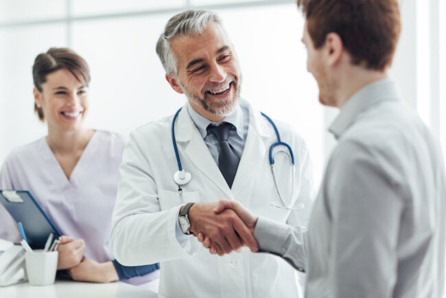 Smiling,Doctor,At,The,Clinic,Giving,An,Handshake,To,His Prairie Spine And Pain Institute: Testimonial