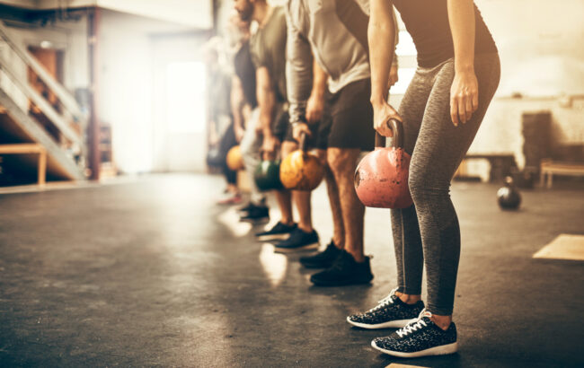 Fit,Group,People,In,Exercise,Gear,Standing,In,A,Row The Benefits Of Cross-Training For Runners