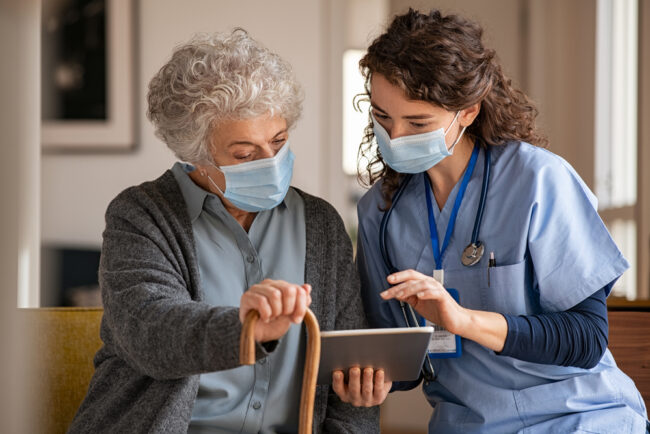 Doctor,And,Senior,Woman,Going,Through,Medical,Record,On,Digital
